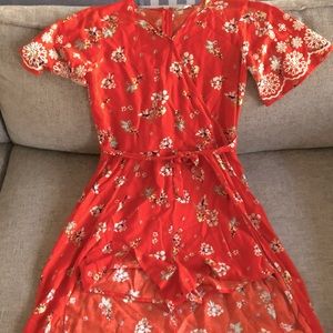 Very pretty orange floral romper.